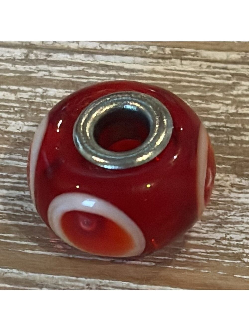 TROLLBEADS murano glass bead sterling silver core red/orange white ‘eyes’